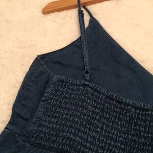 Lightweight, tiered, fit-and-flare style navy top w/adjustable spaghetti straps